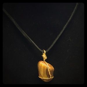 Tiger’s eye stone wrapped in gold copper wire